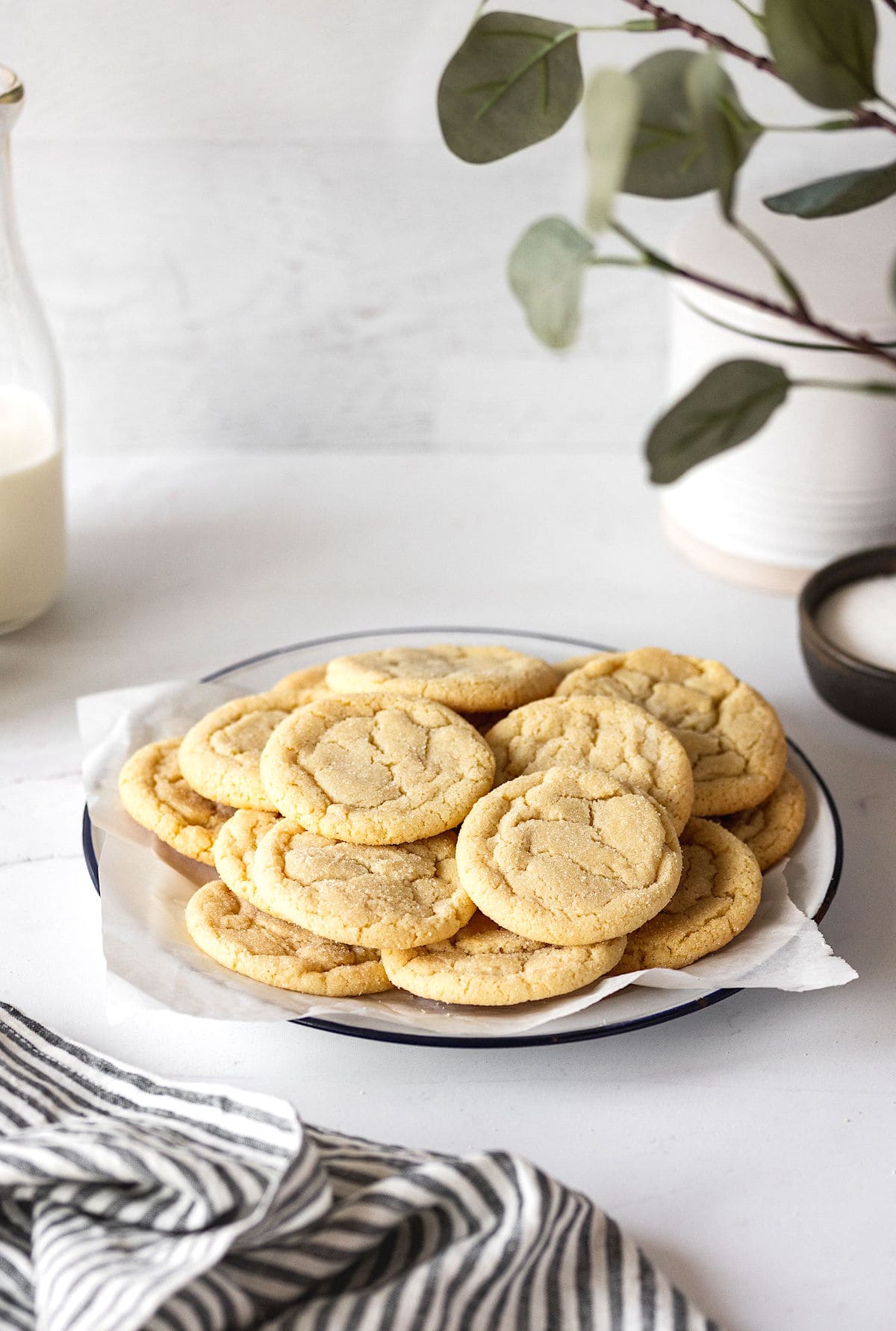 soft and chewy sugar cookies on plate.